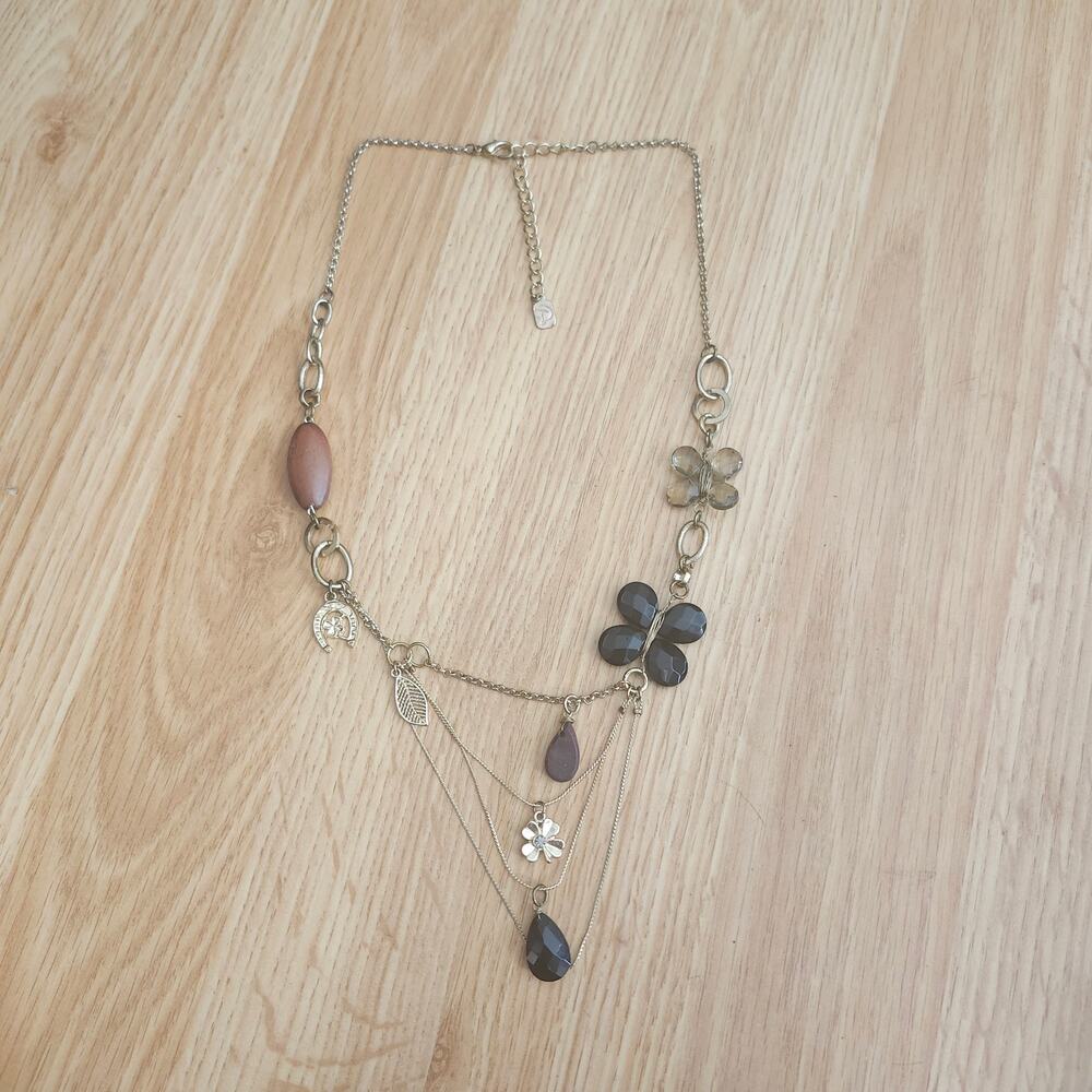 You and I Gold Tone Statement Necklace Clover Horseshoe Floral Teardrop Drape